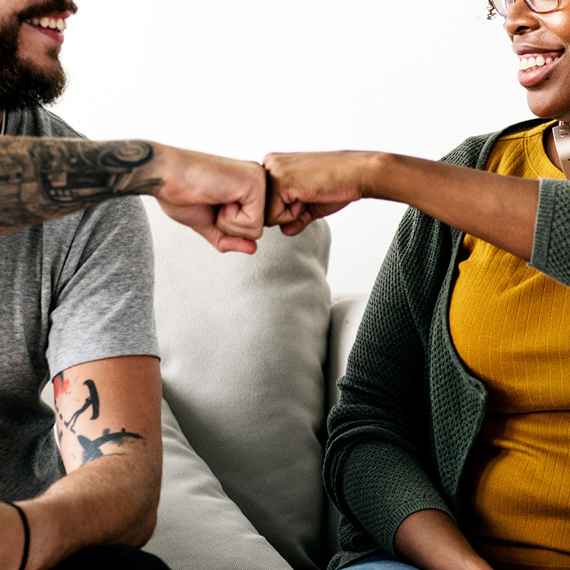 Counselor and patient doing a fist bump